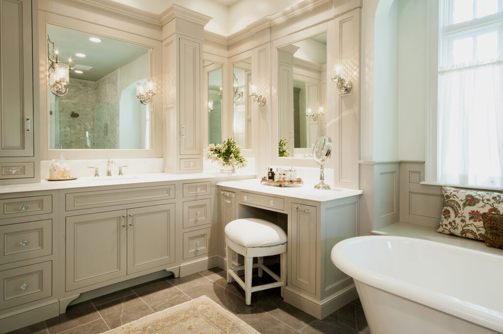 Luxury master bathroom remodel in Algonquin IL with freestanding tub, custom vanity, and classic lighting