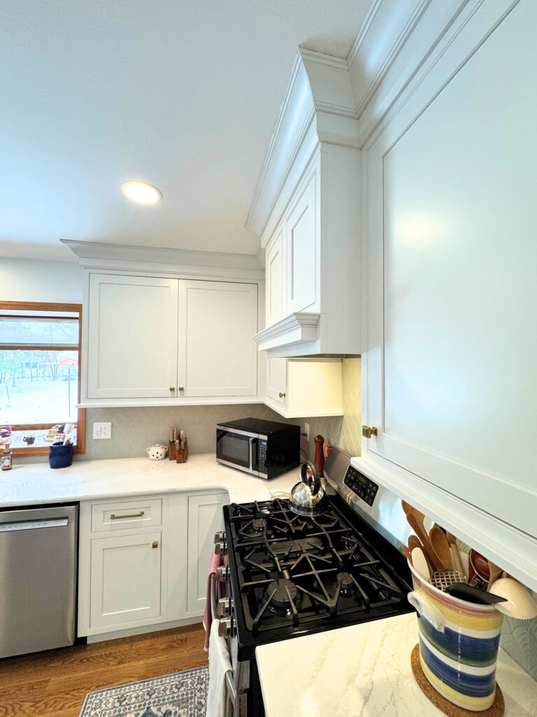 White inset kitchen remodel in Harvard IL with Cambria Everleigh countertops and custom cabinetry