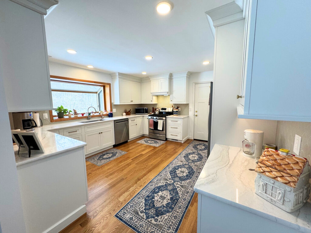 Bright white kitchen remodel in Harvard IL after removing outdated wallpaper