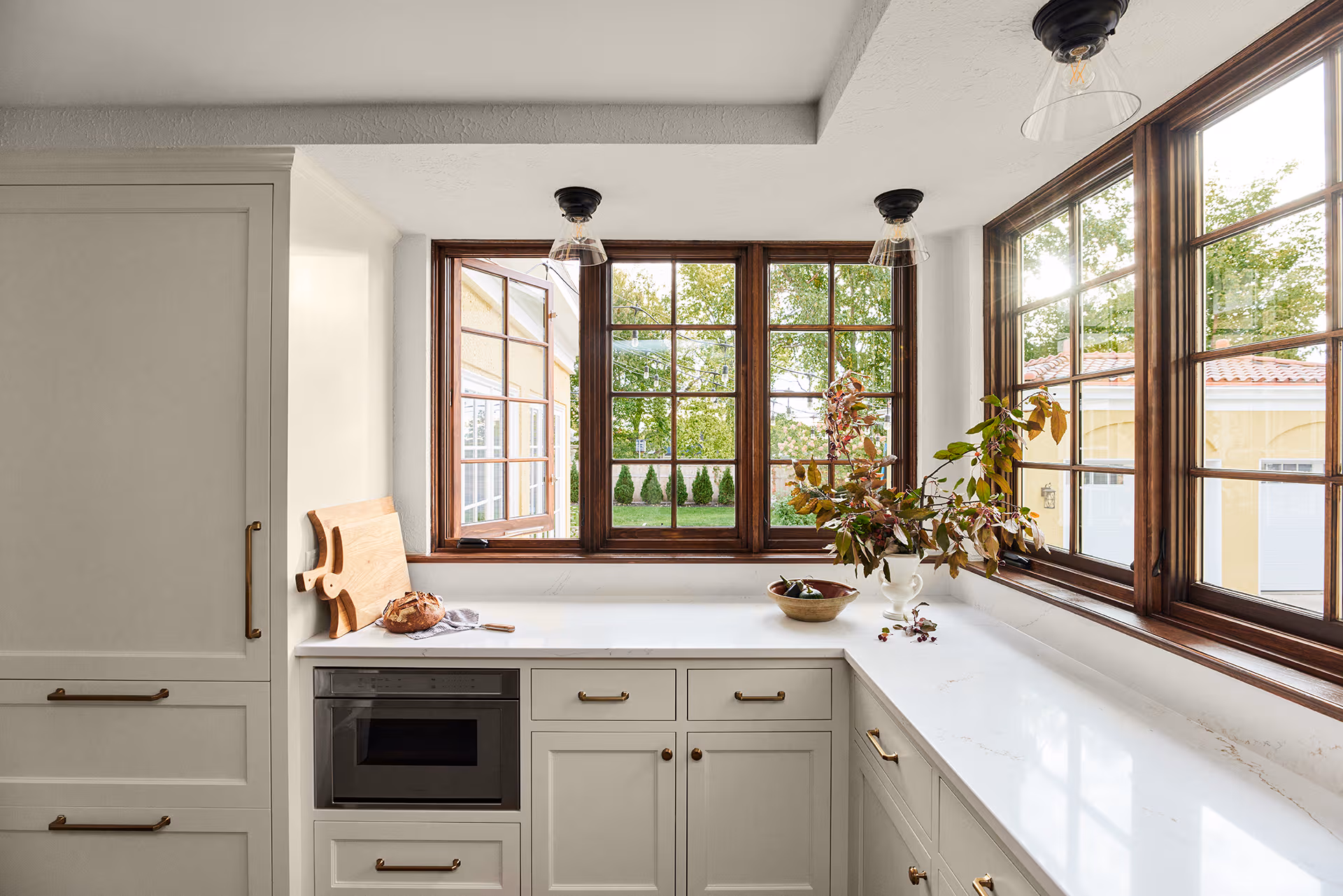 Marvin Ultimate casement windows with aluminum exterior and stained wood interior in luxury kitchen