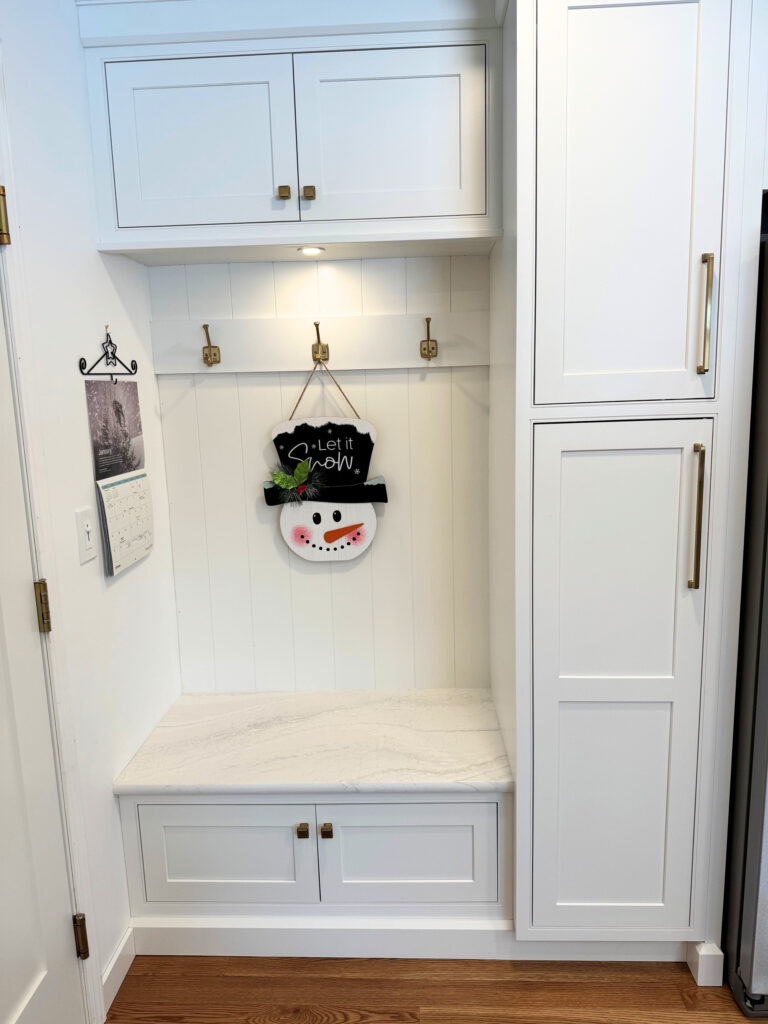 Built-in mudroom bench and storage in kitchen remodel