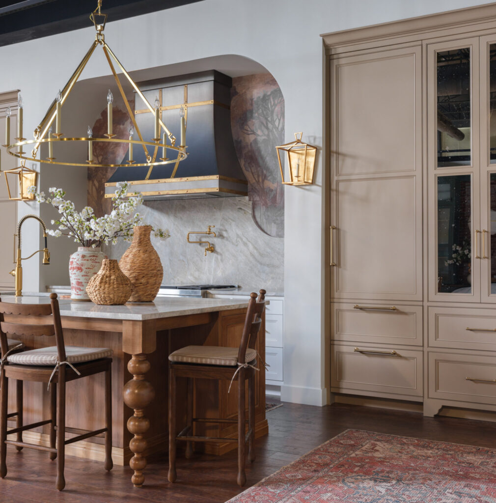 Stratford inset alder island and Plaza Inset Café cabinetry featured in Mouser Cabinetry Working Kitchen showroom.