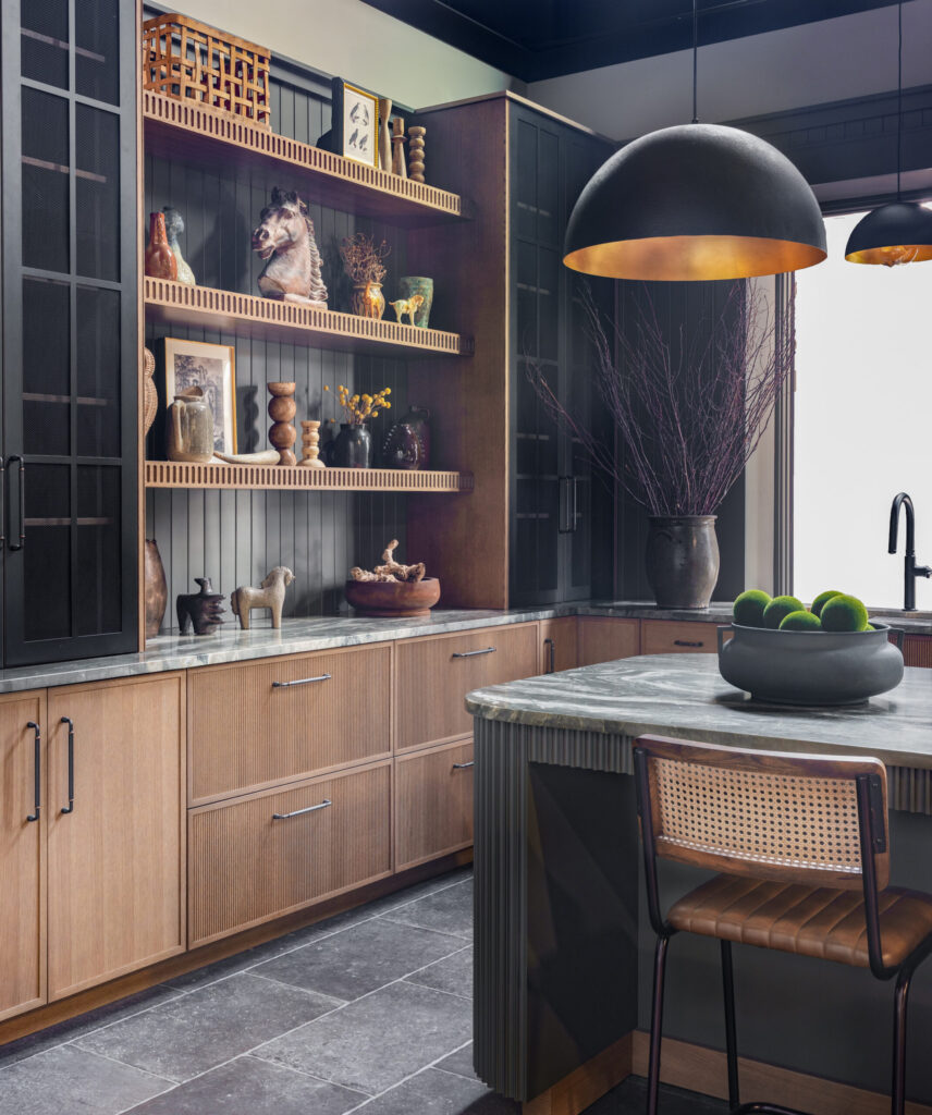 Benjamin Moore Deep Creek island with Pembroke Inset cabinetry and custom open shelving in Mouser Cabinetry showroom.