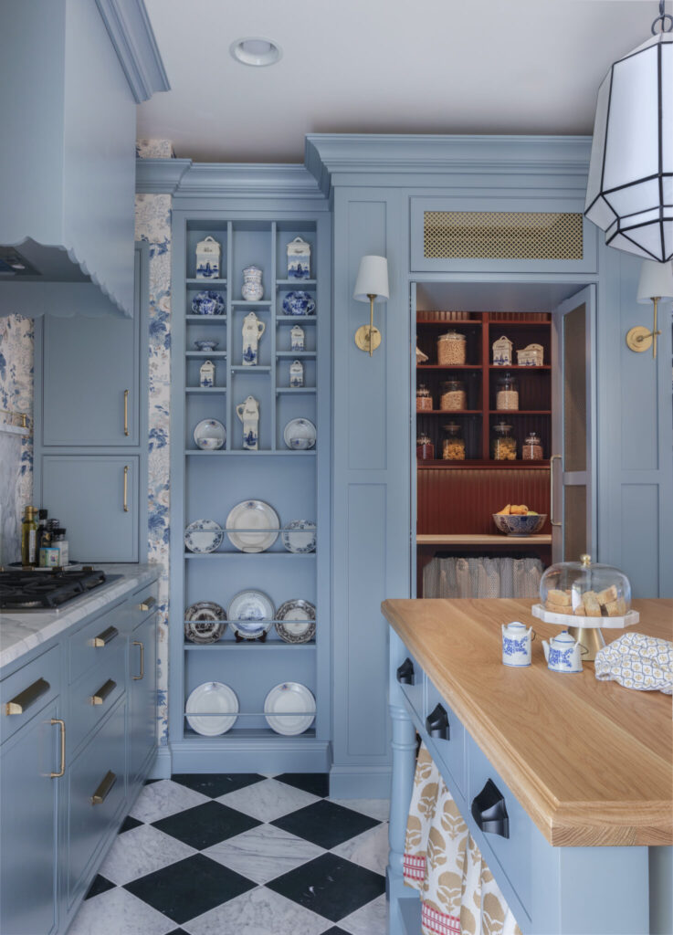 Portrait beaded inset Twilight cabinetry with hidden scullery pantry storage and custom organization by Mouser Cabinetry.