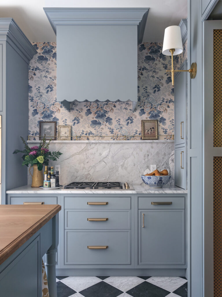 Custom Mouser wood hood above cooking area with Portrait beaded inset Twilight cabinetry in luxury scullery.
