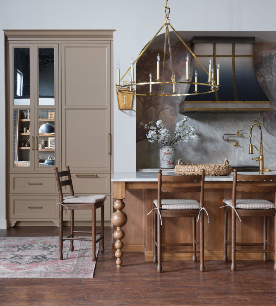 Luxury working kitchen featuring Stratford inset cabinetry in Linen Paint on Maple, alder island in Vintage Natural Black, and custom kitchen design by Mouser Cabinetry.