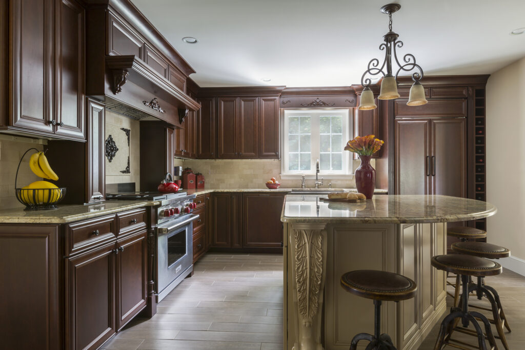 Traditional cherry kitchen remodel featuring raised panel cabinetry and a custom island, showcasing one of the returning cabinet trends for 2026.