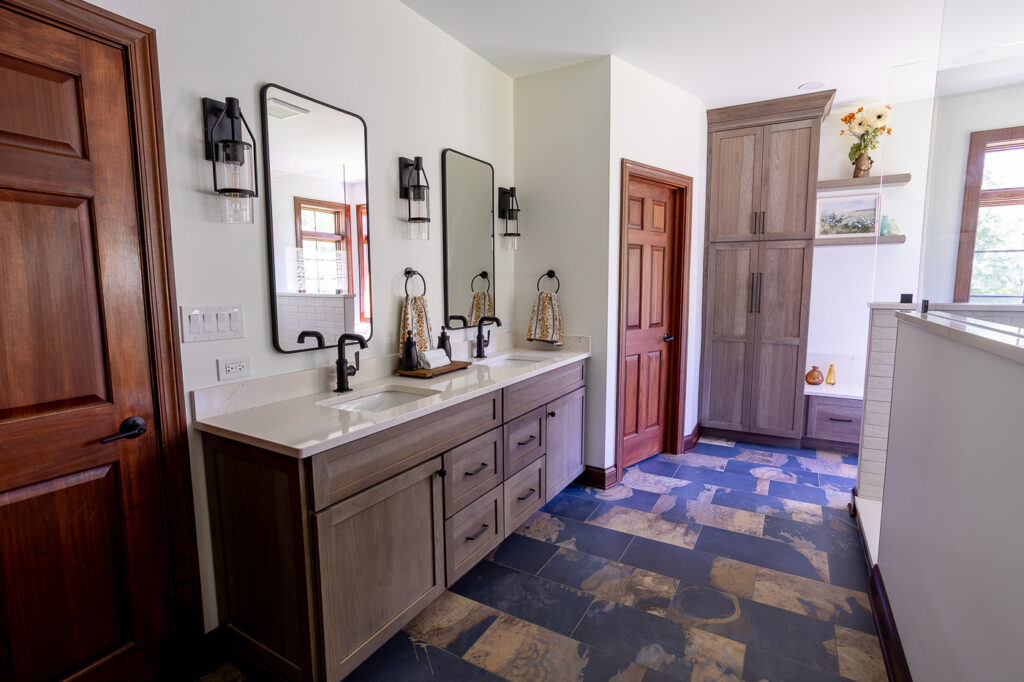 Luxury master bathroom remodel in Woodstock, IL featuring custom Mouser Hickory cabinetry with the Amity door style, Cambria Colton quartz countertops, California Faucets fixtures, Marvin Elevate windows, and a spacious walk-in shower by CSL Interior.